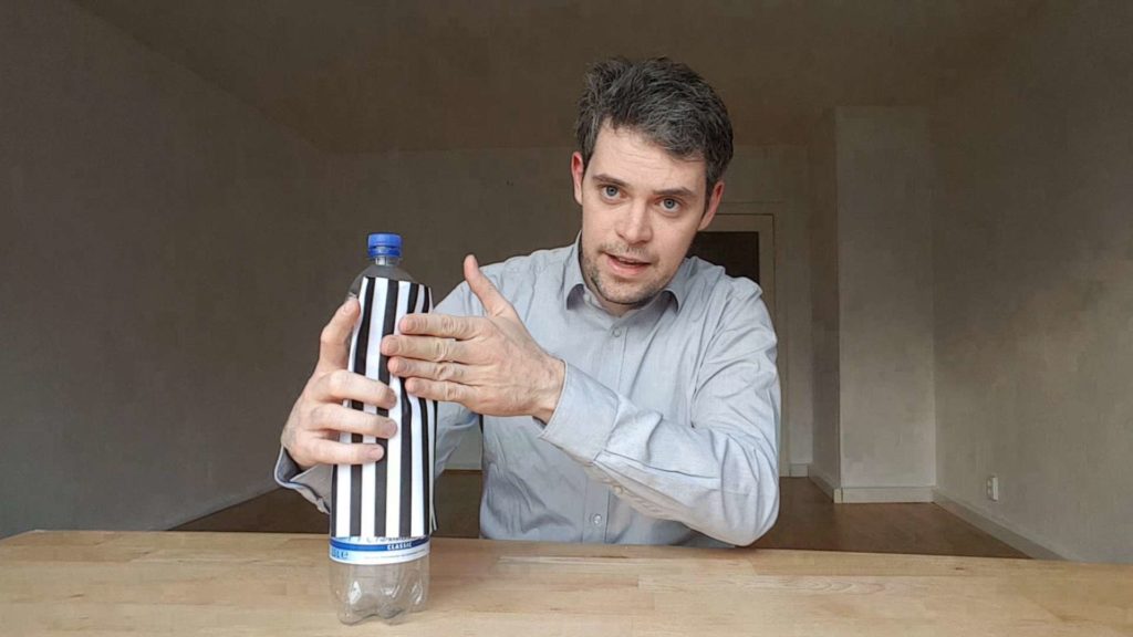 Swann Rack explains structured-light 3D scanner with a fringe pattern on a water bottle